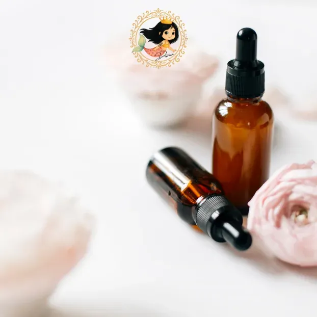 Amber dropper bottles beside pink flowers.
